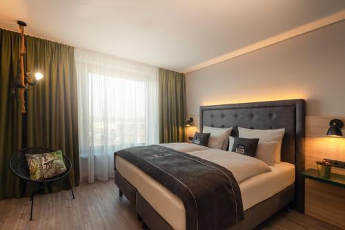 Un ou plusieurs lits dans un hébergement de l'établissement Holiday Inn - the niu, Crusoe Bremen Airport by IHG