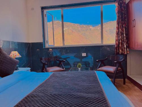 Postel nebo postele na pokoji v ubytování Doon Sach Valley Resort - Kempty Fall, Mussoorie