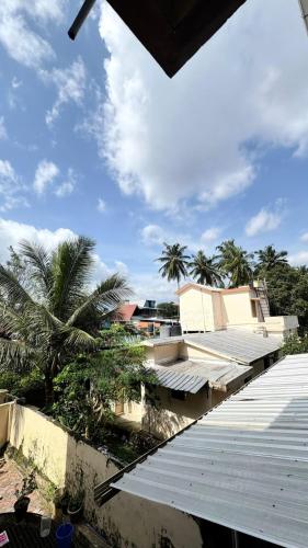 a view from the roof of a building with palm trees at Chandras appartment in Palakkad