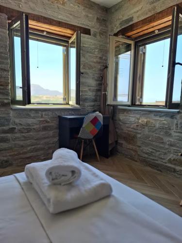 Кровать или кровати в номере Bellevia Stone Pool Villa