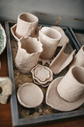 a group of cups and hats sitting on a tray at Uroczysko Oleśnica in Chodzież