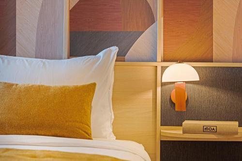 Un ou plusieurs lits dans un hébergement de l'établissement Hotel Acta Moa