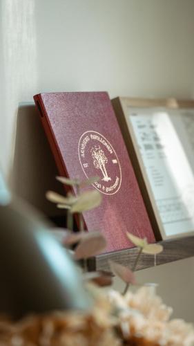 a british passport sitting on top of a book at Arnbjerg Pavillonen in Varde