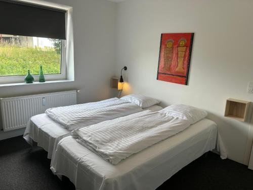 Katil atau katil-katil dalam bilik di Ammitsbøl Apartment D