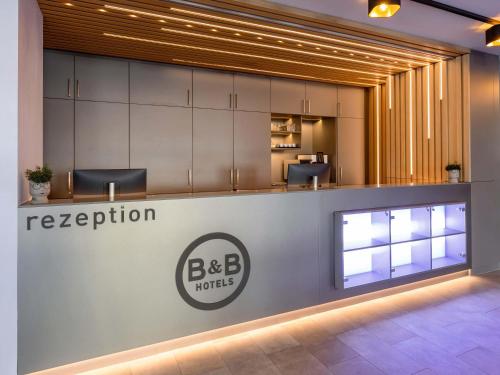 a reception area of a building with a big b hotel at B&B HOTEL Bad Hersfeld in Bad Hersfeld