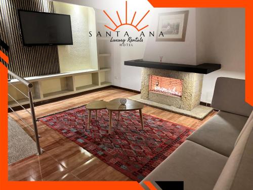 a living room with a fireplace and a tv at Hotel Santa Ana Luxury Rentals - 111 in Estación El Salto