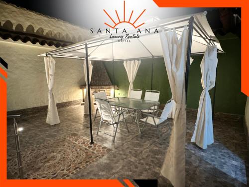 a tent with a table and chairs in a room at Hotel Santa Ana Luxury Rentals - 111 in Estación El Salto