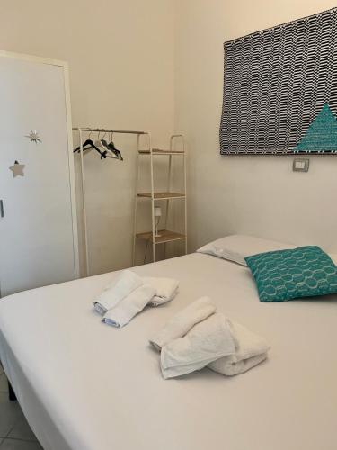 Ένα ή περισσότερα κρεβάτια σε δωμάτιο στο Namasté Suite - Porto Pino