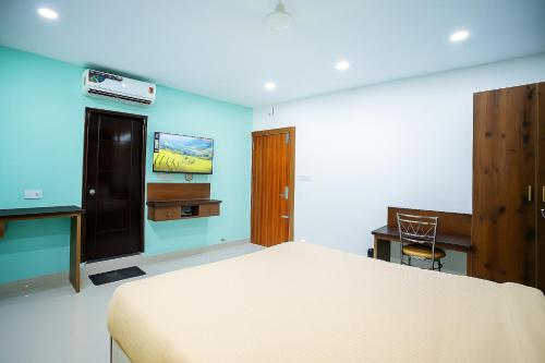Cama o camas de una habitación en Ishwerya Oasis- A unit by Tranquil Homes