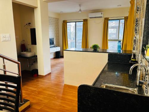 a kitchen with a sink and a counter top at City Of Music - Nirvana in Pali