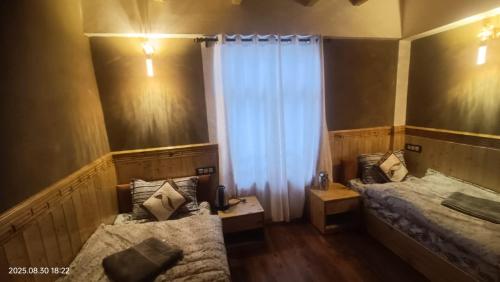 Ένα ή περισσότερα κρεβάτια σε δωμάτιο στο Spiti Sidharth Homestay