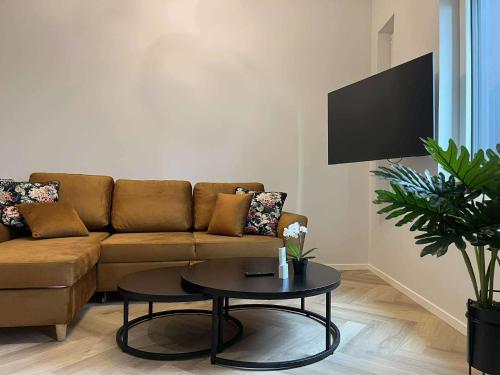a living room with a couch and a table at Luise LuXe Suites in Tallinn