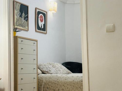 Ένα ή περισσότερα κρεβάτια σε δωμάτιο στο Ramblas Apartments BCN