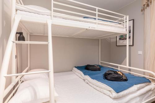 two bunk beds in a room with a blue bed at Åre Travel- Freestyle in Åre