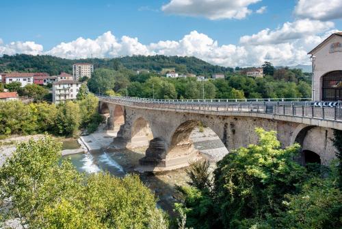 a bridge over a river in a city at Outlet2000 in Serravalle Scrivia