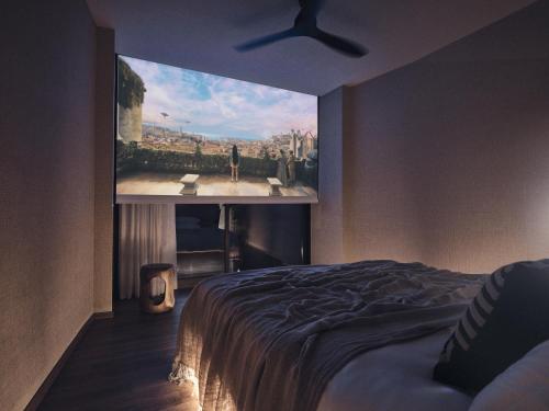 a bedroom with a large painting on the wall at Prosilio olive tree houses in Tsilivi