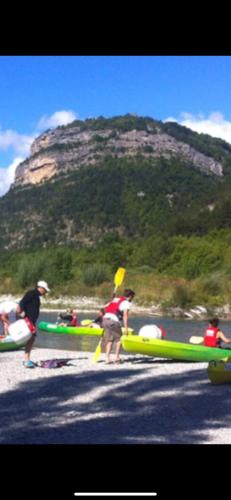 a group of people on a beach with boats at Chalet 1 in Aouste-sur-Sye