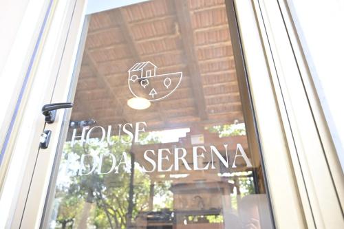 a sign on a glass door of a house da serena at House Edda Serena - Casa Vacanze Salerno in Pontecagnano