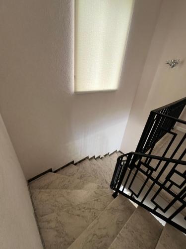 an empty room with a staircase and a ceiling at Red Brick House in Şürük