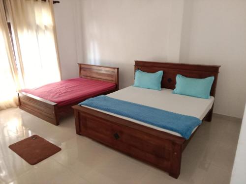 Postel nebo postele na pokoji v ubytování Bosadi holiday home katunayaka