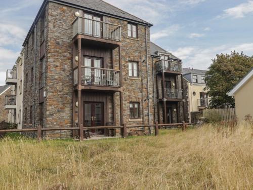 an apartment building with balconies on the side of it at Awel y Môr in Burry Port
