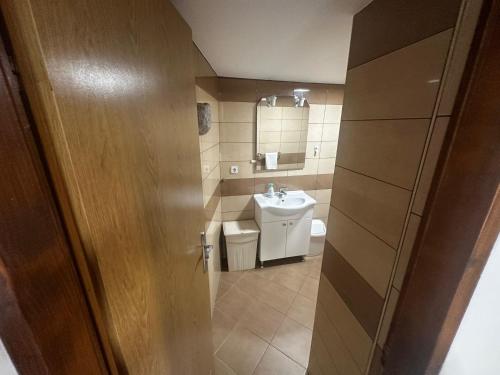 a small bathroom with a sink and a toilet at Holiday Home Traum in Krk