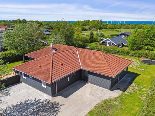 an overhead view of a house with an orange roof at Holiday Home Eunice - 850m from the sea by Interhome in Glesborg