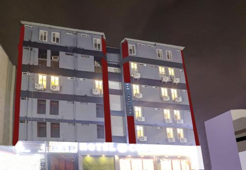 a tall apartment building with its lights on at Townhouse S Continental in Hyderabad