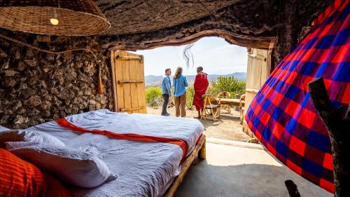 Una cama o camas en una habitación de Maasai Sacred Site - Africa Amini Life