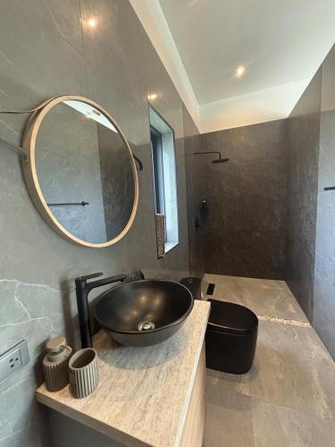 a bathroom with a sink and a mirror at Villa Selva, Lamai in Amphoe Koh Samui