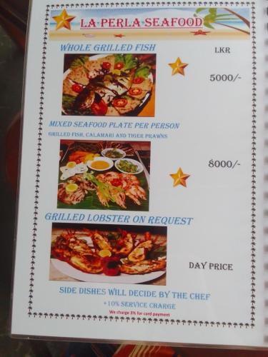 a menu for the la perla seafood restaurant at La Perla Bentota in Bentota
