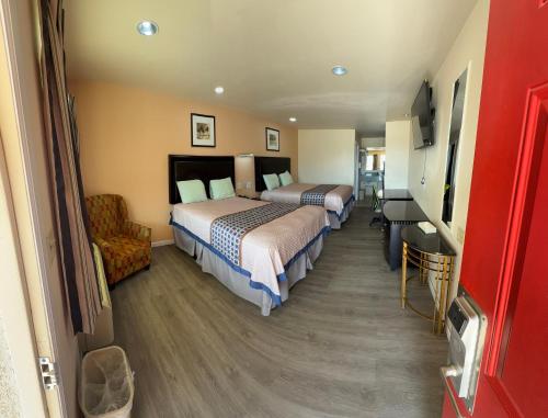 Ένα ή περισσότερα κρεβάτια σε δωμάτιο στο Denver City Motel