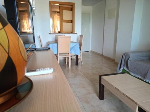 a living room with a couch and a table at Oropesa twin horizons in El Borseral