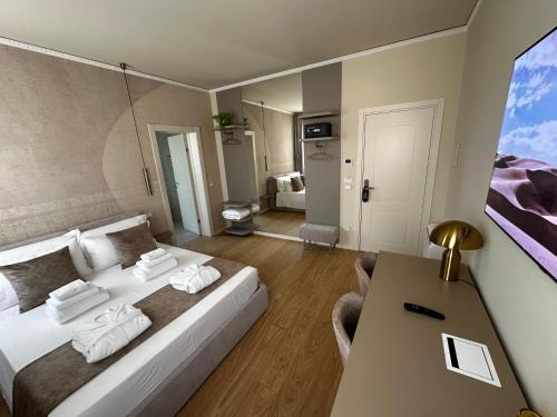 a bedroom with a bed and a table in a room at Villa Margherita in Padova