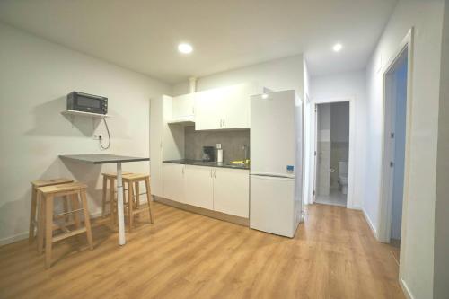 Η κουζίνα ή μικρή κουζίνα στο Apartamentos Lúa Atlántica