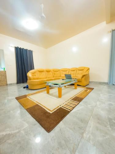 a living room with a couch and a table at Apartments in Sukuta high way in Serekunda