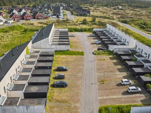 an aerial view of a parking lot with cars parked at Holiday Home Mimi - 900m from the sea by Interhome in Blokhus