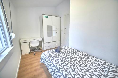 Ένα ή περισσότερα κρεβάτια σε δωμάτιο στο Apartamentos Lúa Atlántica