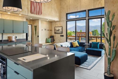 an open kitchen and living room with a couch at OMI Combo in Creede, CO in Creede
