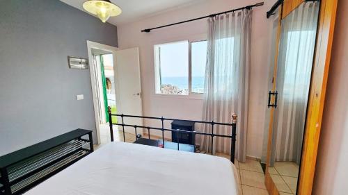 Postel nebo postele na pokoji v ubytování Escapada tranquila en primera línea de mar
