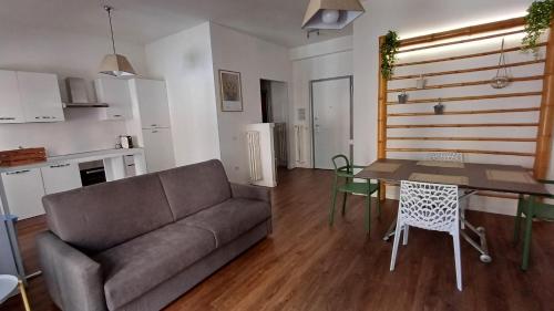 a living room with a couch and a table at Casa Maricciotti in Terni