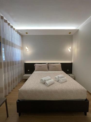 Ένα ή περισσότερα κρεβάτια σε δωμάτιο στο Dimora Lucia termoli