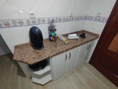 a kitchen with a counter top with a sink at Precioso apartamento totalmente reformado in Alcalá de Guadaira