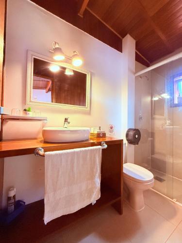 a bathroom with a sink and a toilet and a shower at MAKTVB - EcoLodge San Pedro de Atacama in San Pedro de Atacama