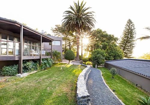 a house with a garden and a house at Von Wyn Berg in Stellenbosch