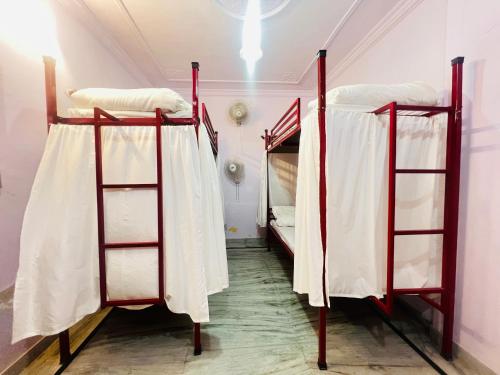 a room with two bunk beds in a room at Hostel The Dara in Jaisalmer