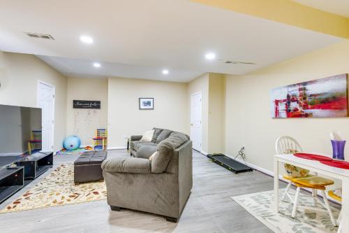 a living room with a couch and a tv at Pets Welcome! Cozy Family Apartment in Sterling in Sterling