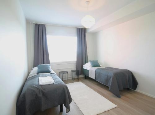 Katil atau katil-katil dalam bilik di Spacious Apartment for 5