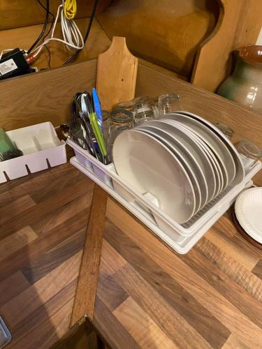 a kitchen sink sitting on a wooden table at Guest House Väikesaare in Narva