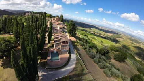 an aerial view of a house with trees at Podere Le Grotte in San Gimignano